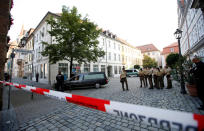 <p>A hearse leaves the area after an explosion in Ansbach near Nuremberg, Germany, July 25, 2016. (REUTERS/Michaela Rehle)</p>