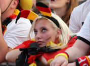 BERLIN, GERMANY - JUNE 22: A supporter of Germany watch the UEFA EURO 2012 quarter final match between Germany and Greece at a public viewing zone called 'fan mile' near the Brandenburg Gate on June 22, 2012 in Berlin, Germany. (Photo by Matthias Kern/Getty Images)