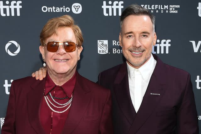 <p>Sonia Recchia/Getty</p> Elton John and David Furnish