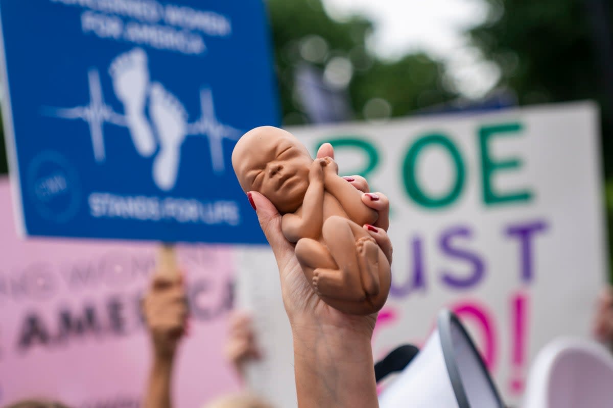 Abortion rights activists and anti-abortion activists rally at the Supreme Court (EPA)