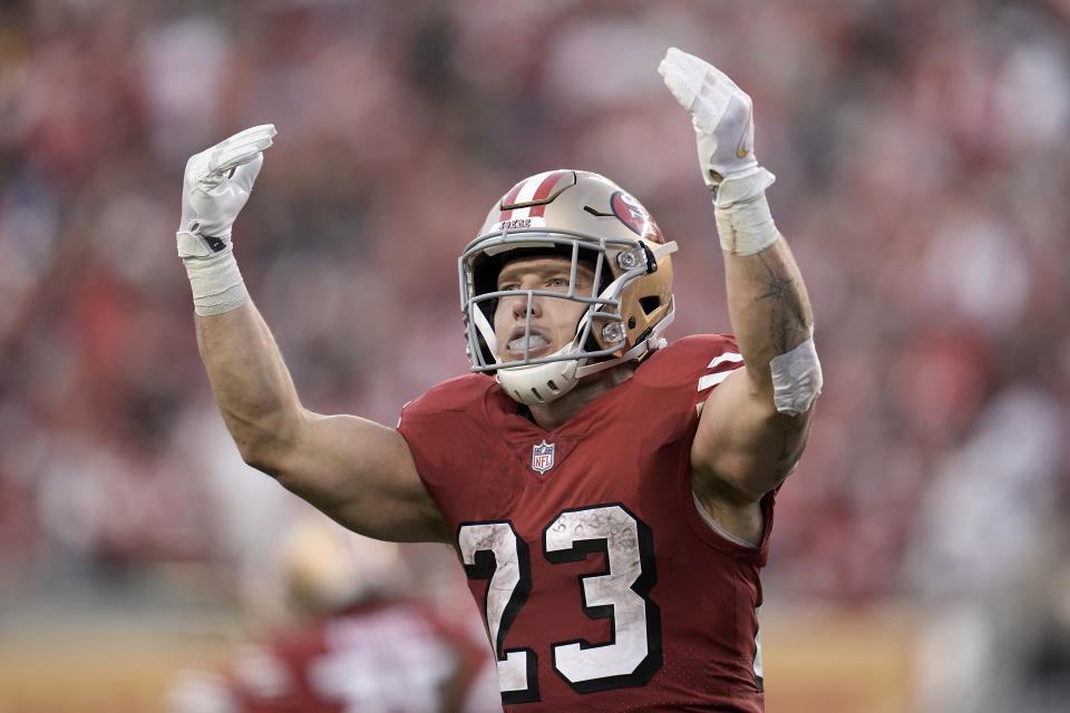 FILE - San Francisco 49ers running back Christian McCaffrey (23) celebrates after scoring against the New York Giants during the first half of an NFL football game in Santa Clara, Calif., Thursday, Sept. 21, 2023. McCaffrey has been scoring at record-setting pace so far this season. That performance has helped the San Francisco 49ers star score the honor as being voted the top running back in the league by The Associated Press. (AP Photo/Godofredo A. Vásquez, File)