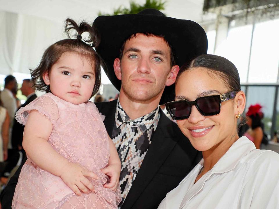 <p>Paul Morigi/Getty </p> Sunny Fine, Alex Fine and Cassie Fine attend Preakness 147 at Pimlico Race Course on May 21, 2022 in Baltimore, Maryland. 