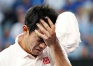 Tennis - Australian Open - Quarter-final - Melbourne Park, Melbourne, Australia, January 23, 2019. Japan's Kei Nishikori reacts after retiring the match against Serbia's Novak Djokovic. REUTERS/Kim Kyung-Hoon