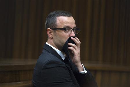 Oscar Pistorius looks on during his trial at the North Gauteng High Court in Pretoria, May 13, 2014. REUTERS/Daniel Born/Pool