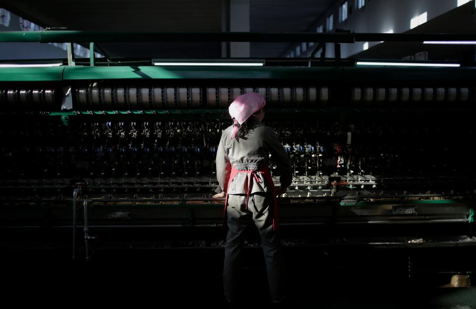 A shaft of light from the morning sun illuminates a woman as she sorts out silkworm cocoons to be boiled at the Kim Jong Suk Silk Mill in Pyongyang, North Korea, on Jan. 6, 2017. The silk mill, named after North Korean leader Kim Jong Un's grandmother, is where 1,600 workers _ mostly women _ sort and process silkworms to produce silk thread that officials at the factory say is made into roughly 200 tons of silk a year.