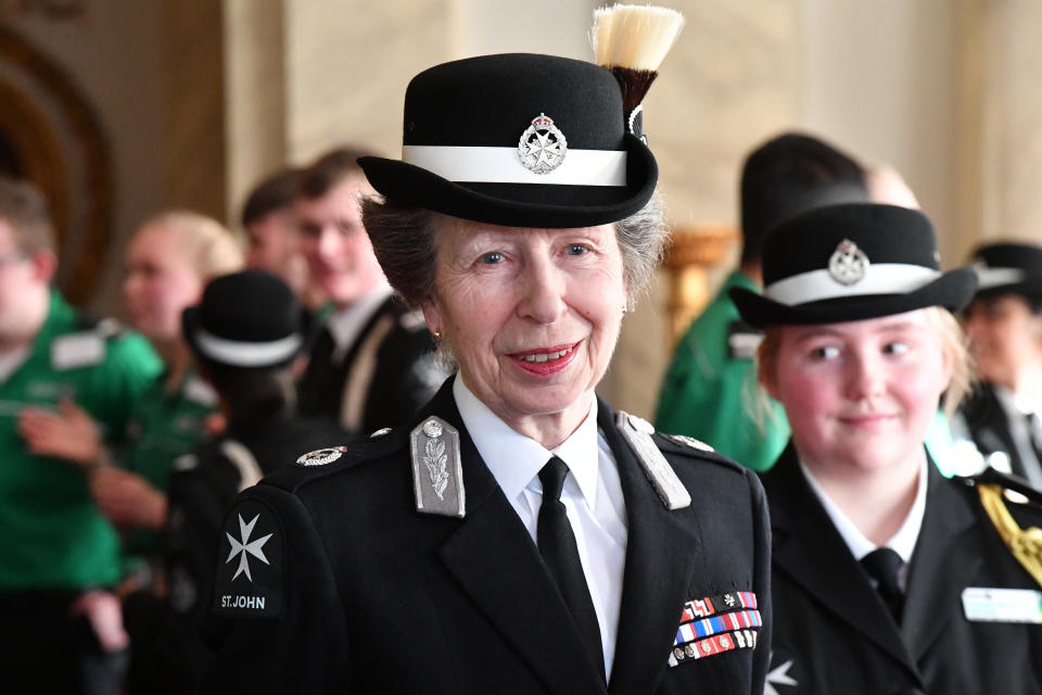 Woman wearing a hat and blazer 