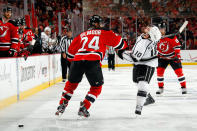 NEWARK, NJ - JUNE 09: Mike Richards #10 of the Los Angeles Kings draws contact from Bryce Salvador #24 of the New Jersey Devils during Game Five of the 2012 NHL Stanley Cup Final at the Prudential Center on June 9, 2012 in Newark, New Jersey. (Photo by Bruce Bennett/Getty Images)