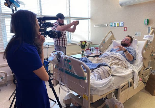 PHOTO: Photojournalist Jesse Walden is visited by colleagues in the hospital after being shot in Orlando, Feb. 22, 2023. (Courtesy Molly Duerig)