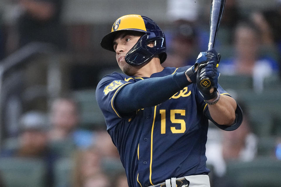 FILE -Milwaukee Brewers' Tyrone Taylor watches his RBI single during the second inning of the team's baseball game against the Atlanta Braves on Friday, July 28, 2023, in Atlanta. The New York Mets acquired right-handed pitcher Adrian Houser and outfielder Tyrone Taylor from the Milwaukee Brewers on Wednesday, Dec. 20, 2023 for minor league pitcher Coleman Crow. (AP Photo/John Bazemore, File)