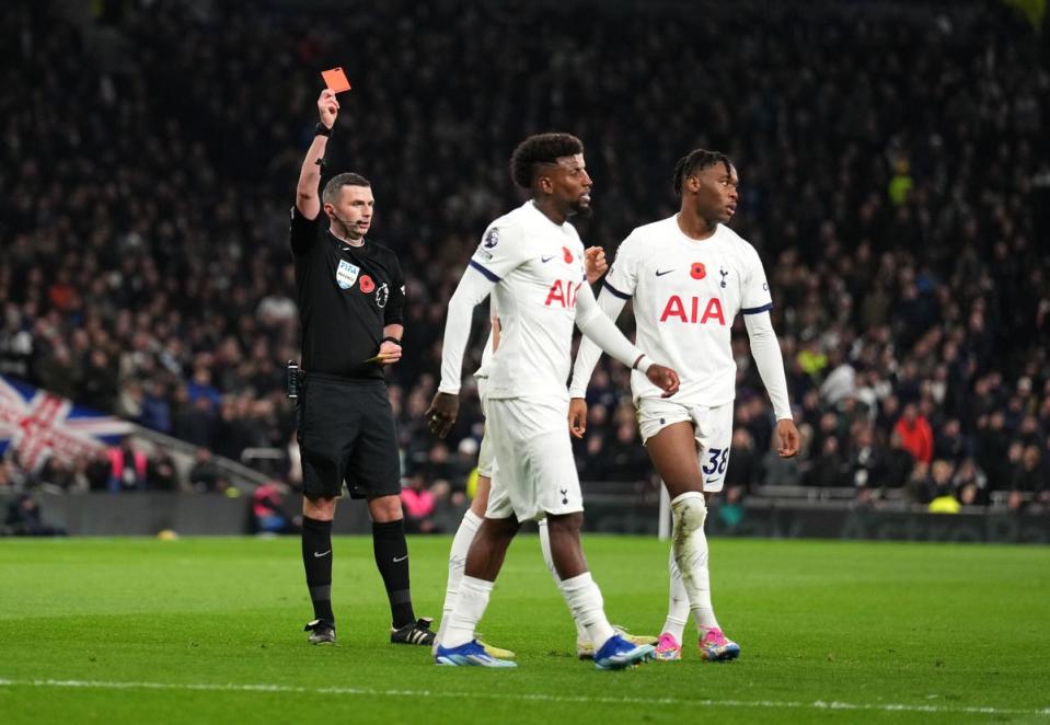 Destiny Udogie was shown a second yellow 10 minutes after half-time to deepen Tottenham's plight (PA)