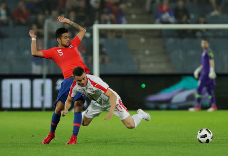 Soccer Football - International Friendly - Serbia vs Chile - Merkur-Arena, Graz, Austria - June 4, 2018 Serbia’s Filip Kostic in action with Chile’s Paulo Diaz REUTERS/Heinz-Peter Bader