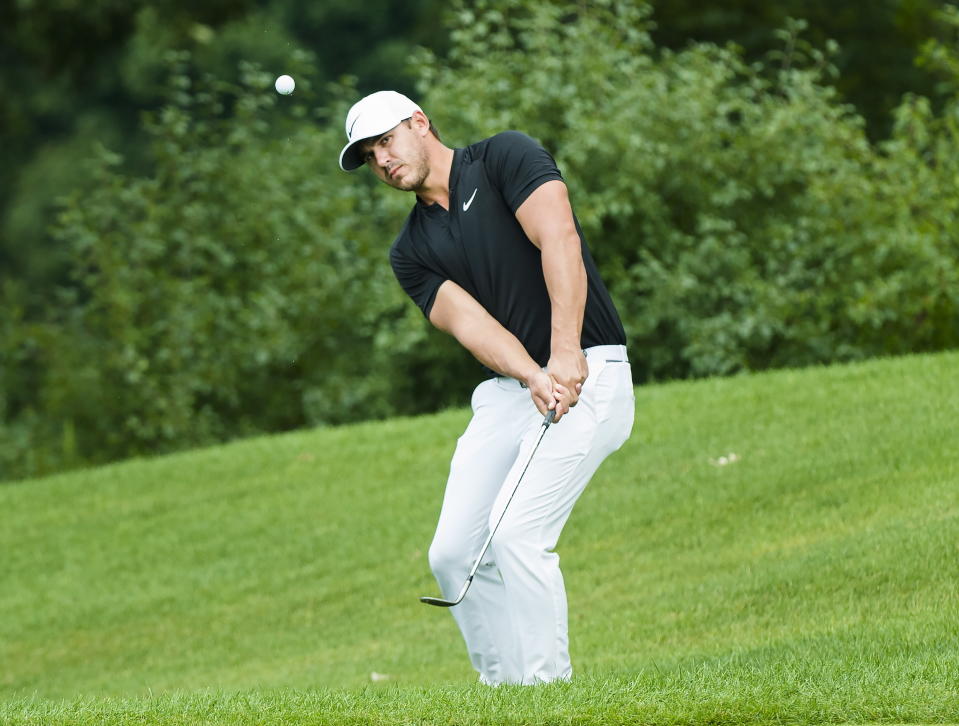 Brooks Koepka hits from the rough on the first hole during the first round of the the Canadian Open golf tournament at Glen Abbey in Oakville, Ontario, Thursday, July 26, 2018. (Nathan Denette/The Canadian Press via AP)