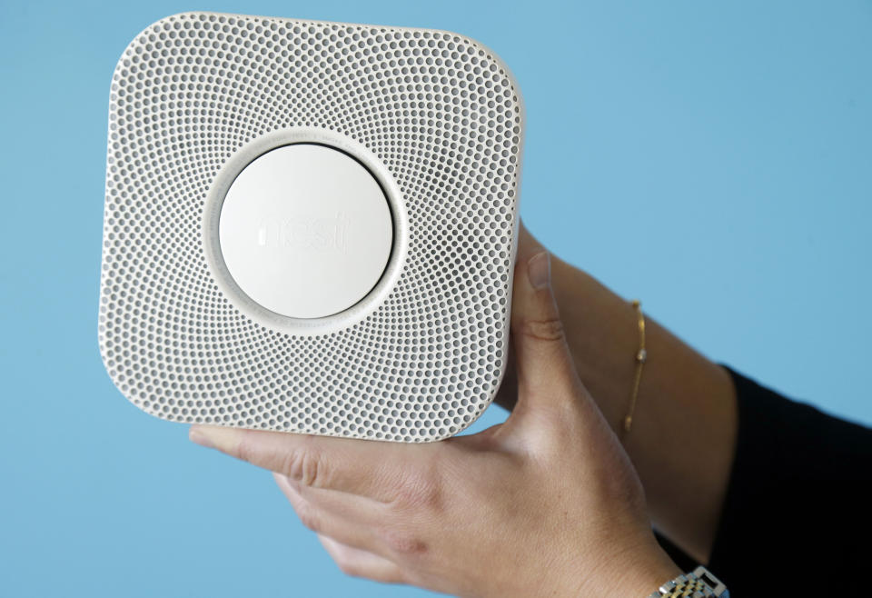 The Nest smoke and carbon monoxide alarm is shown at the company's offices on Tuesday, Oct. 1, 2013, in Palo Alto, Calif. Tony Fadell, a gadget guru who helped design the iPod and original iPhone while working at Apple, is counting on his latest innovation to prove that a smoke detector can be sleek, smart and appreciated. (AP Photo/Marcio Jose Sanchez)