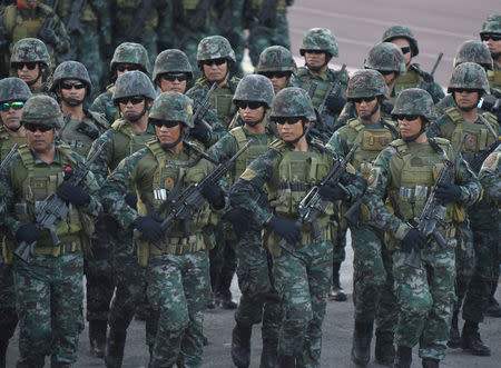 Philippine National Police Special Action Force (PNP-SAF) troopers march during the National Police chief handover ceremony in Camp Crame, Quezon City, metro Manila, Philippines, April 19, 2018. REUTERS/Dondi Tawatao