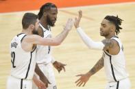 Feb 13, 2019; Cleveland, OH, USA; Brooklyn Nets guard D'Angelo Russell (1) celebrates with forward Joe Harris (12) snf forward DeMarre Carroll (9) in the third overtime against the Cleveland Cavaliers at Quicken Loans Arena. David Richard-USA TODAY Sports