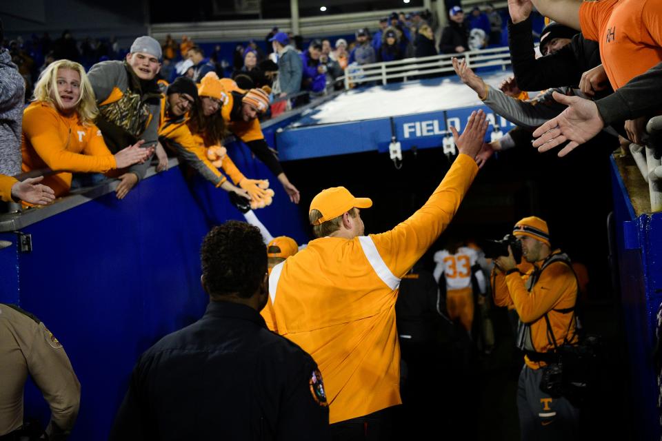 Tennessee Head Coach Josh Heupel high-fives fans after defeating Kentucky 45-42 at Kroger Field in Lexington, Ky. on Saturday, Nov. 6, 2021.