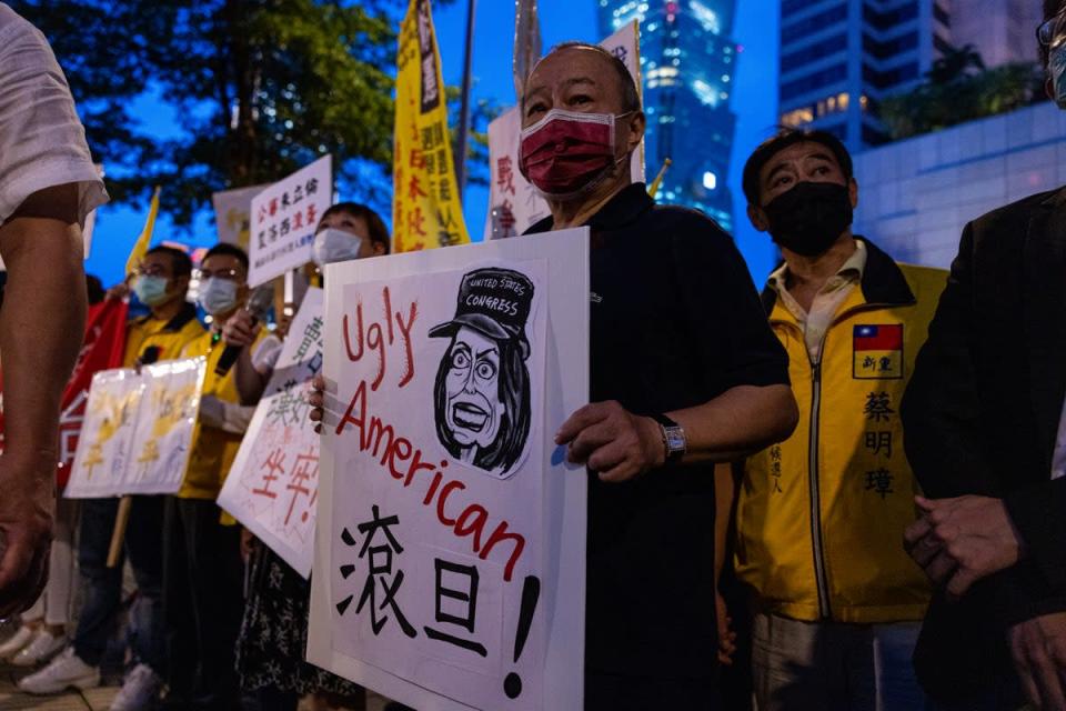 Demonstrators take part in a protest in Taipei against Nancy Pelosi’s Taiwan visit on 2 August (Getty)