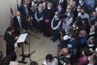 Lebanese head principal of the Carmel Saint Joseph school Mother Antoinette Oweit, left, speaks as French Foreign Minister Jean-Yves Le Drian, second left, listens during his visit to the school in Mechref district, south of the capital Beirut, Lebanon, Friday, July 24, 2020. Le Drian pledged on Friday €15 million ($17 million) in aid to Lebanon's schools, struggling under the weight of the country's major economic crisis. (AP Photo/Bilal Hussein)