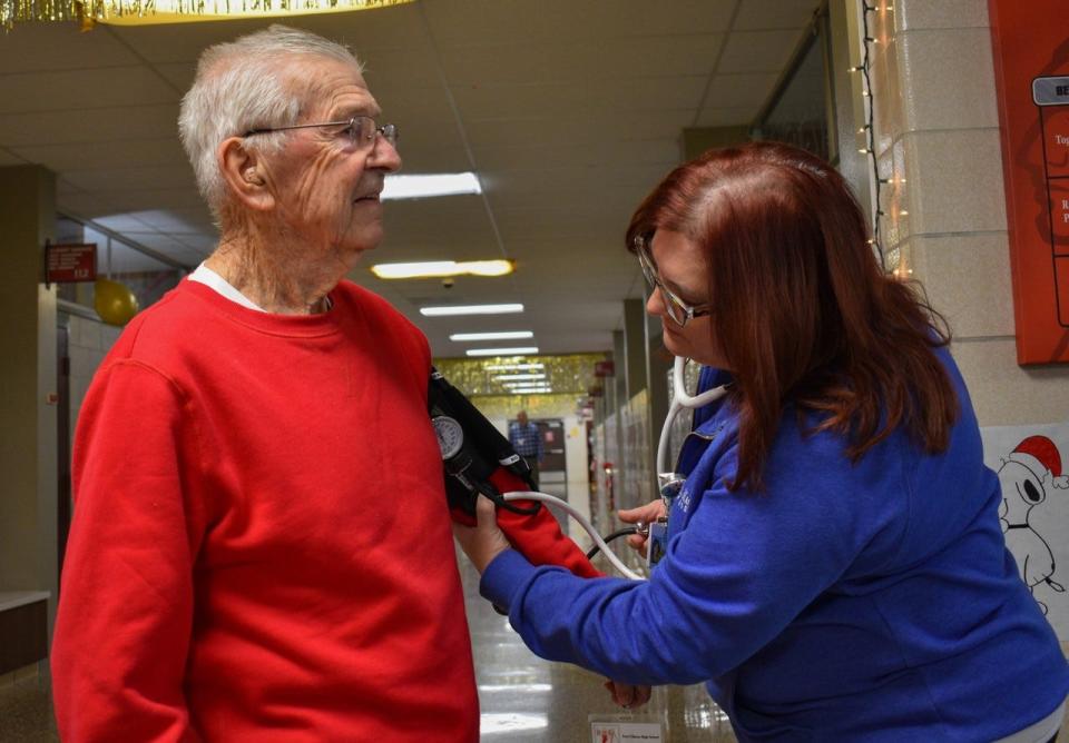 Rebecca Votino, director of surgery at Magruder Hospital, checks Dick Stein’s blood pressure after he walked the halls of Port Clinton High School on Dec. 15. A Magruder nurse offers free blood pressure checks during Walking Club on the third Thursday of each month.
(Photo: Sheri Trusty/Correspondent)