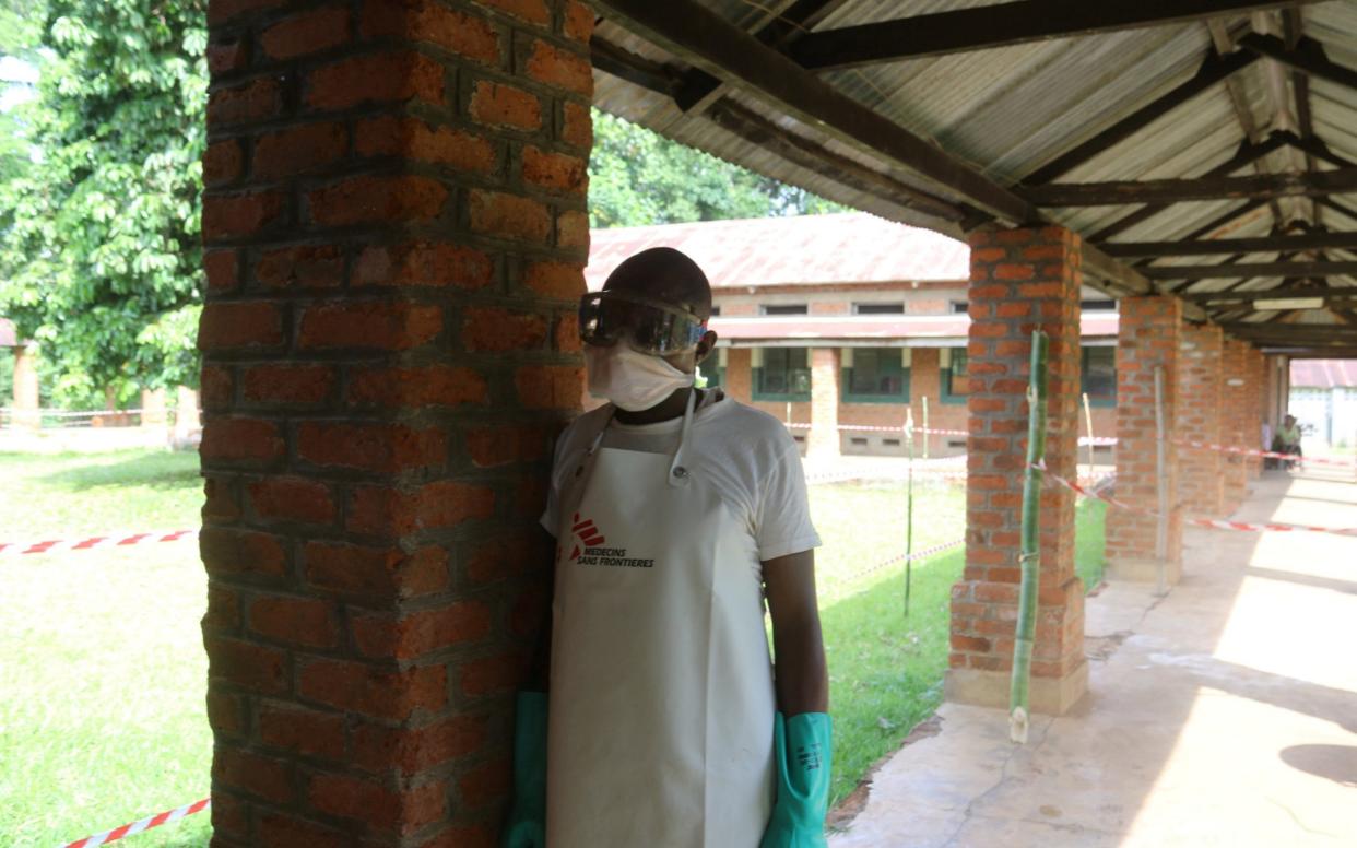 A health worker in protective clothing at Bikoro hospital  - REUTERS