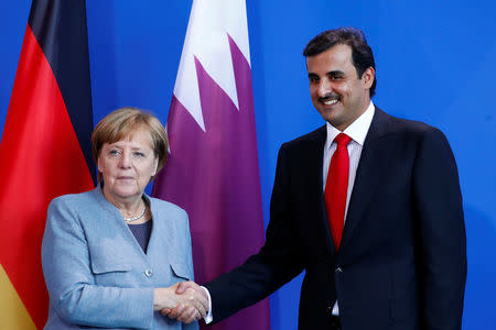 German Chancellor Angela Merkel and Qatar Emir Sheikh Tamim bin Hamad al-Thani attend a news conference in Berlin, Germany, September 15, 2017. REUTERS/Axel Schmidt