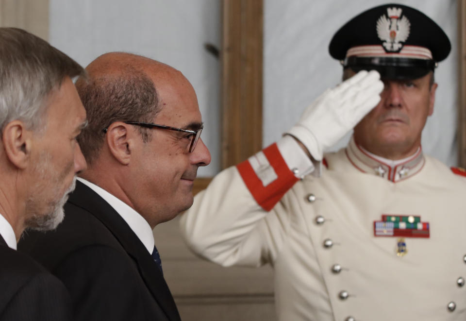 Democratic Party leader Nicola Zingaretti, center, leaves after meeting Italian President Sergio Mattarella, in Rome, Thursday, Aug. 22, 2019. President Sergio Mattarella continued receiving political leaders Thursday, to explore if a solid majority with staying power exists in Parliament for a new government that could win the required confidence vote. (AP Photo/Alessandra Tarantino)