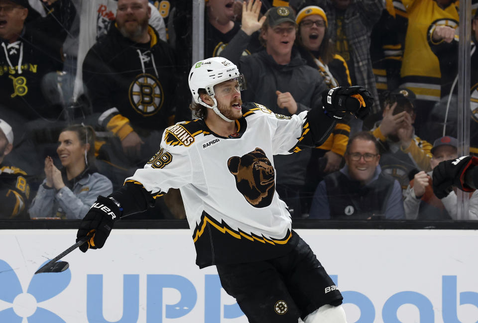 Boston Bruins' David Pastrnak celebrates his second goal of the game during the second period of an NHL hockey game against the Colorado Avalanche Saturday, Dec. 3, 2022, in Boston. (AP Photo/Winslow Townson)