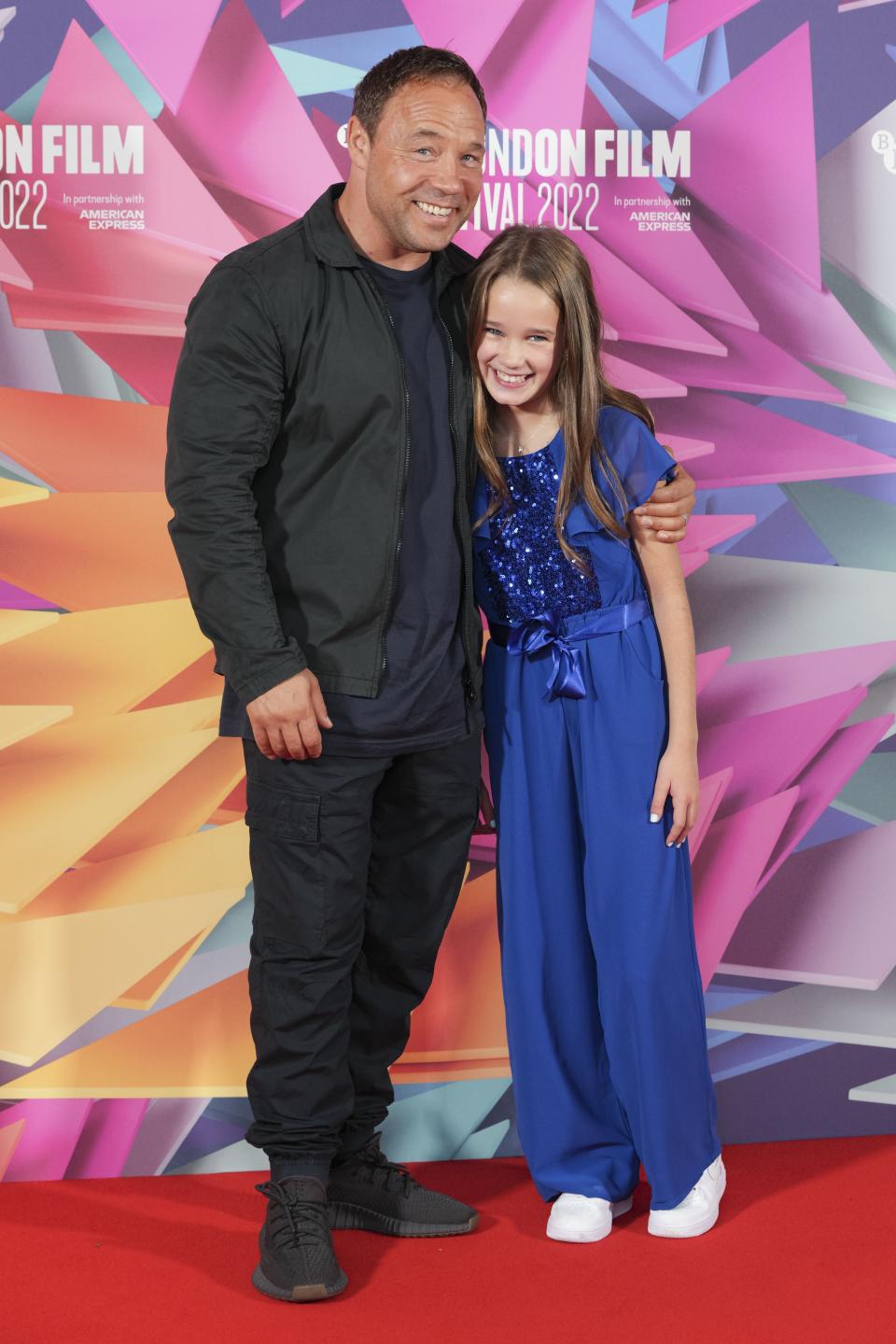 Stephen Graham, left, and Alisha Weir pose for photographers at the photo call for the film 'Roald Dahl's Matilda The Musical' during the 2022 BFI London Film Festival in London, Wednesday, Oct. 5, 2022. (Photo by Scott Garfitt/Invision/AP)