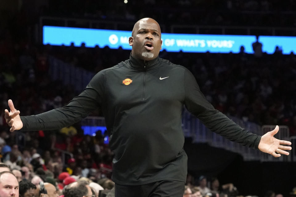 FILE - Atlanta Hawks head coach Nate McMillan reacts after a foul in the second half of an NBA playoff basketball game against the Miami Heat, April 24, 2022, in Atlanta. The Hawks are heading into training camp looking for a bit of a reboot. First up: improving the communication between McMillan and star guard Trae Young. (AP Photo/John Bazemore, File)