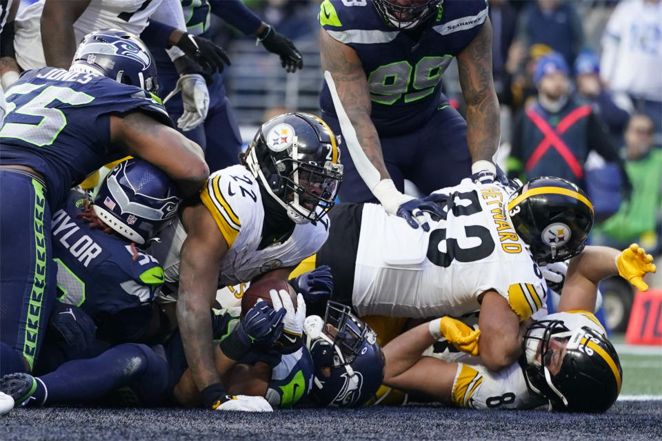 Pittsburgh Steelers running back Najee Harris (22) gets into the end zone for a touchdown against the Seattle Seahawks in the second half of an NFL football game Sunday, Dec. 31, 2023, in Seattle. (AP Photo/Lindsey Wasson)