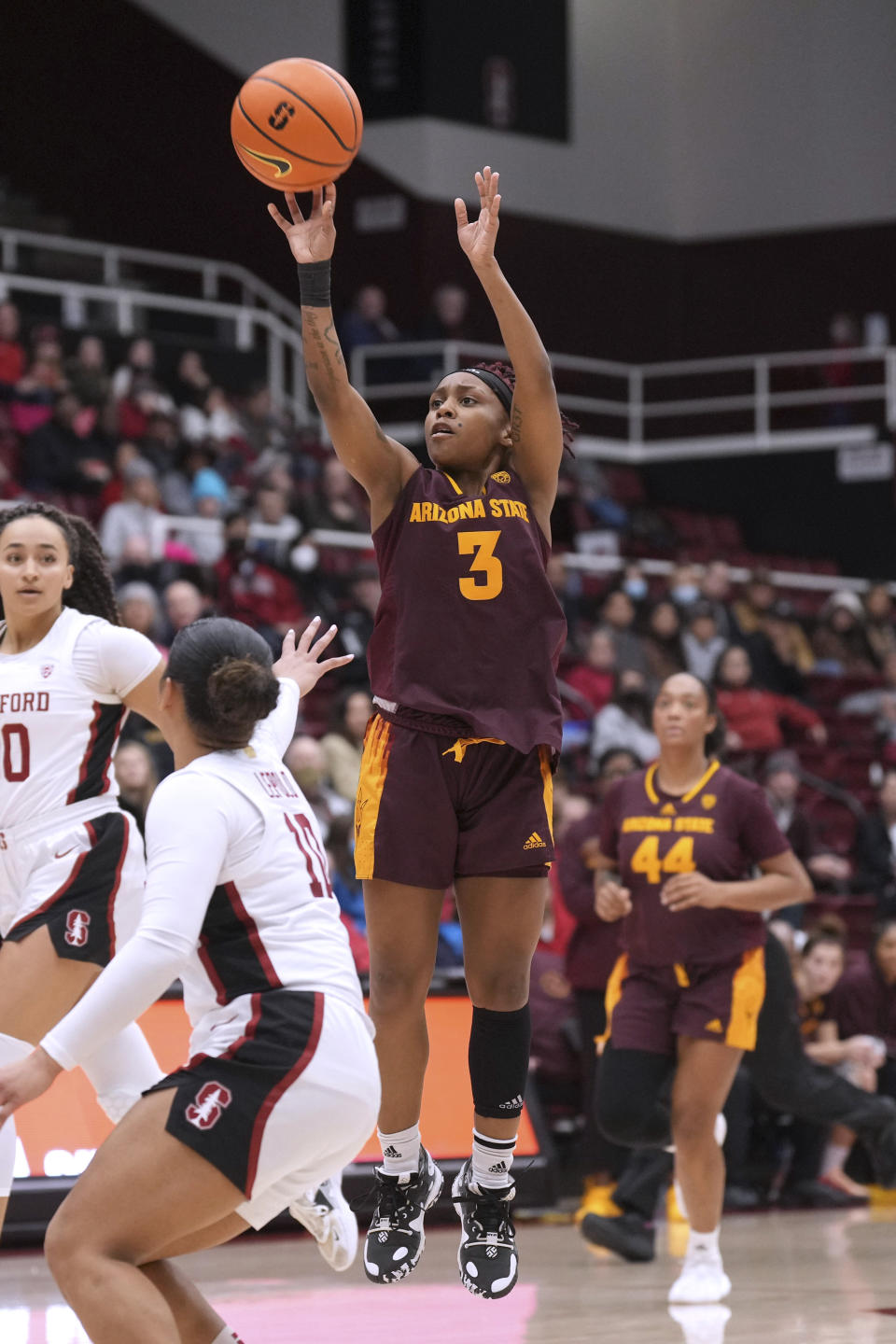 Arizona State guard Tyi Skinner (3) shoots over Stanford guard Talana Lepolo, front, during the first half of an NCAA college basketball game Saturday, Dec. 31, 2022, in Stanford, Calif. (AP Photo/Darren Yamashita)