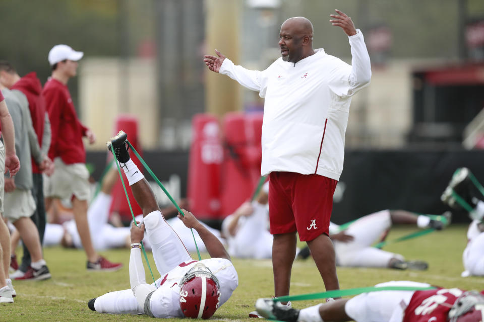 Alabama offensive coordinator Mike Locksley talks to Alabama running back Damien Harris during an NCAA college football practice on Wednesday, Dec. 26, 2018, in Miami Shores, Fla. Alabama plays Oklahoma in the Orange Bowl on Dec. 29. (AP Photo/Brynn Anderson)