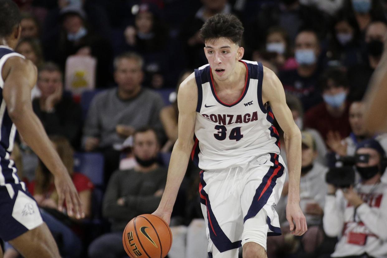 Gonzaga center Chet Holmgren controls the ball during the second half of an NCAA college basketball game against Dixie State, Tuesday, Nov. 9, 2021, in Spokane, Wash. (AP Photo/Young Kwak)