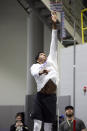 Washington quarterback Michael Penix Jr. does a vertical jump during the team's NFL football pro day Thursday, March 28, 2024, in Seattle. (AP Photo/John Froschauer)