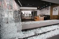 A glass window is smashed at a Pret a Manger store, Wednesday, June 3, 2020, in New York. People broke into the restaurant on Tuesday night. Protesters demonstrated to protest the death of George Floyd who died after he was restrained while in police custody on May 25 in Minneapolis. (AP Photo/Mark Lennihan)
