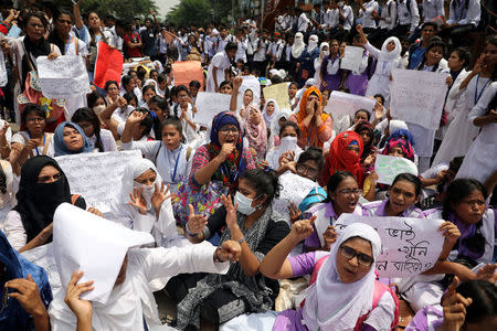 FILE PHOTO: Students shout slogans as they take part in a protest over recent traffic accidents that killed a boy and a girl, in Dhaka, Bangladesh, August 4, 2018. REUTERS/Mohammad Ponir Hossain
