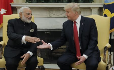 President Donald Trump greets Indian Prime Minister Narendra Modi in the Oval Office at the White House in Washington. REUTERS/Carlos Barria