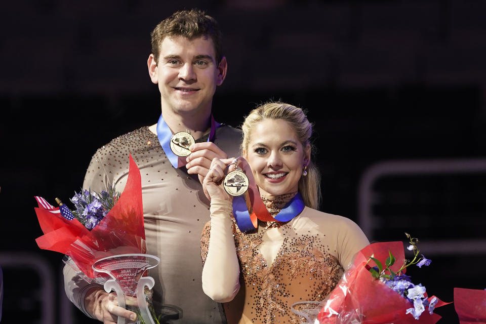 Brandon Frazier, left, and Alexa Knierim hold their medals after the pairs free skate at the U.S. figure skating championships in San Jose, Calif., Saturday, Jan. 28, 2023. Knierim and Frazier finished first in the event. (AP Photo/Tony Avelar)