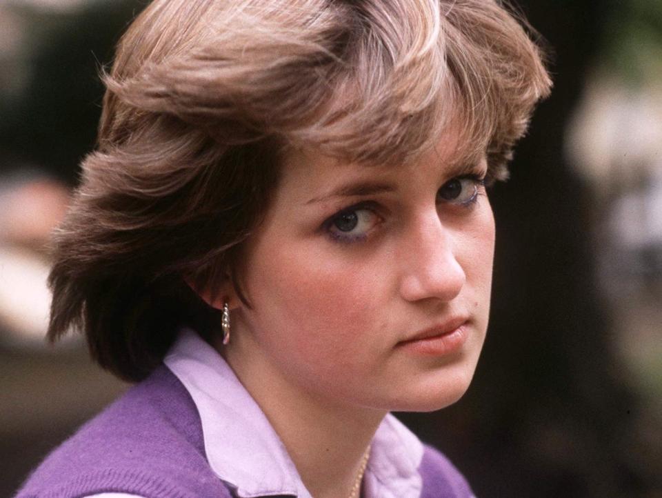 A teenage Lady Diana Spencer poses for a portrait at the Young England Kindergarden Nursery School where she worked in London.