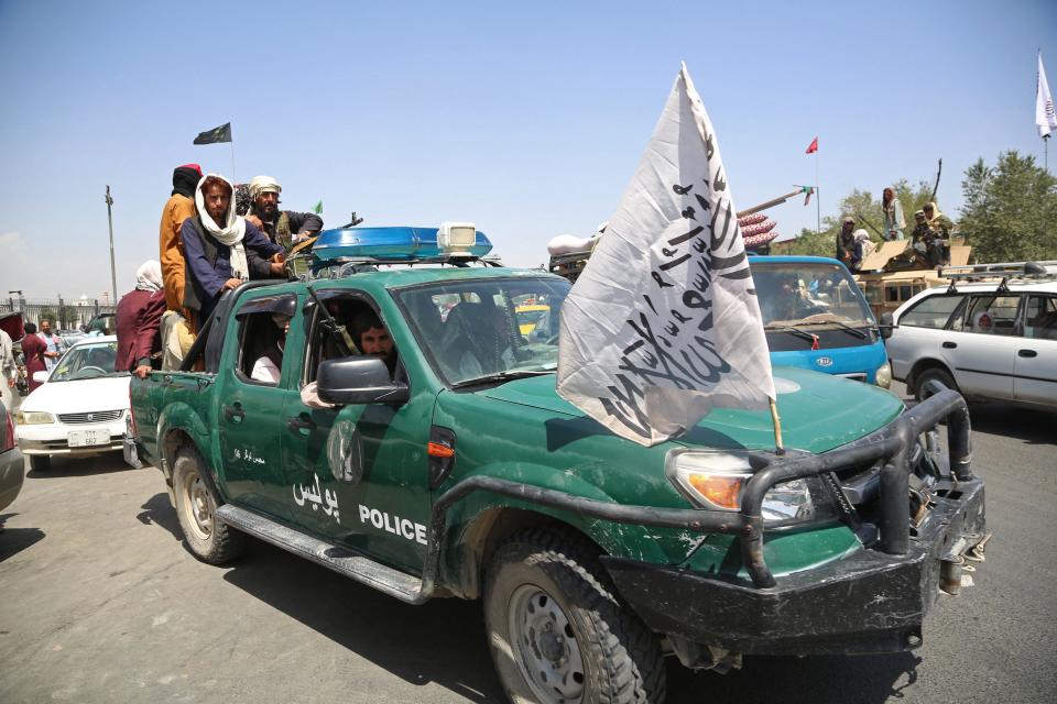 Taliban fighters patrol the streets of Kabul on August 16, 2021, after a stunningly swift end to Afghanistan's 20-year war, as thousands of people mobbed the city's airport trying to flee the group's feared hardline brand of Islamist rule. (-/AFP via Getty Images)