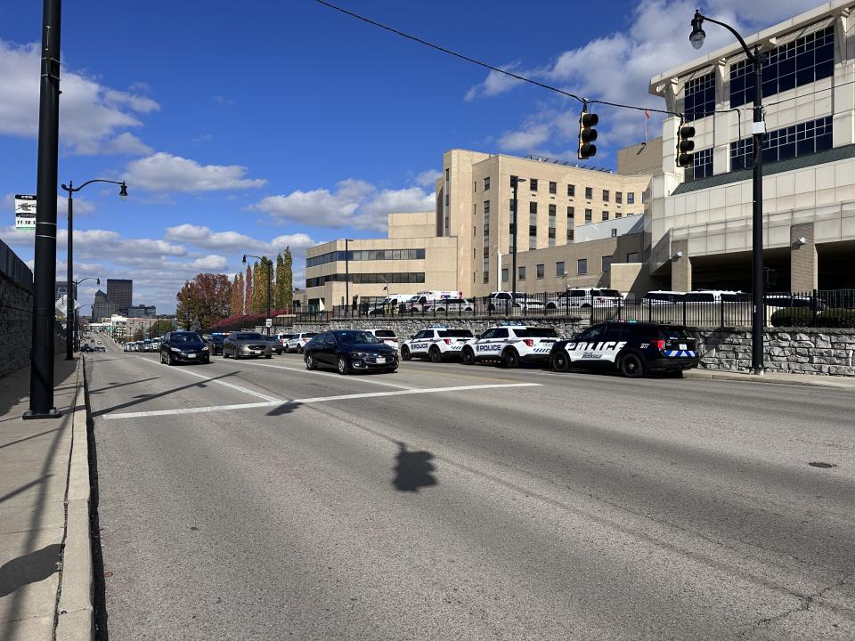 Dozens of officers and state troopers from across several cities in Montgomery and Greene counties gathered outside Miami Valley Hospital Tuesday as Officer Cody Cecil was released from Miami Valley Hospital five days after he was shot while serving a warrant in Clayton. (Scott Kessler/Staff)