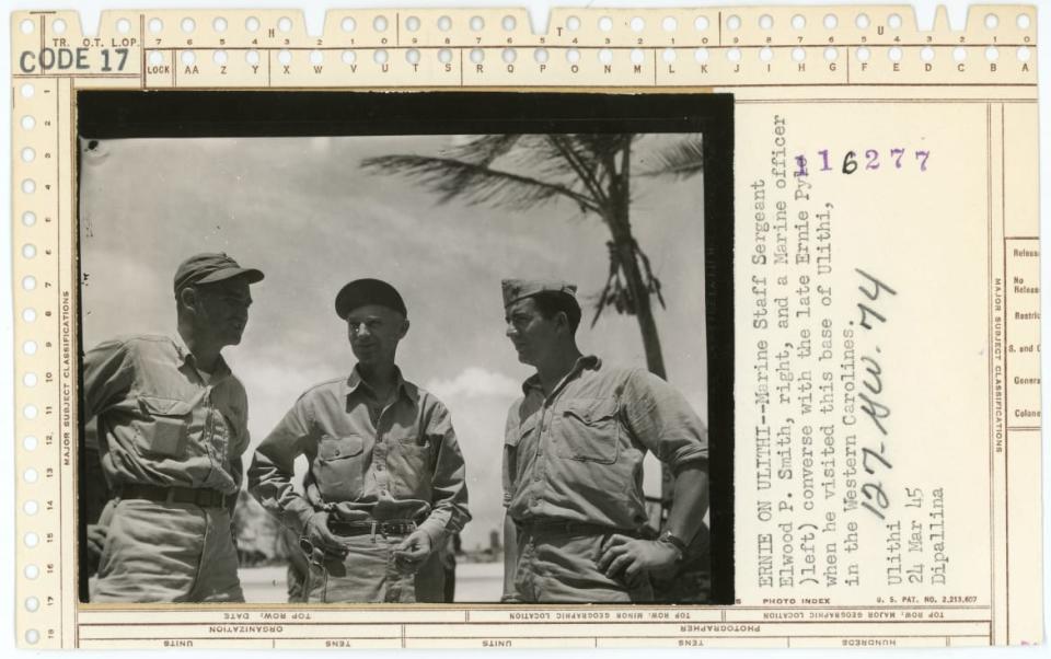 <div class="inline-image__caption"><p>Marine Staff Sergeant Elwood P. Smith (right) and a Marine officer (left) converse with the late Ernie Pyle (center) when he visited this base on Ulithi in the Western Carolines.</p></div> <div class="inline-image__credit">National Archives</div>