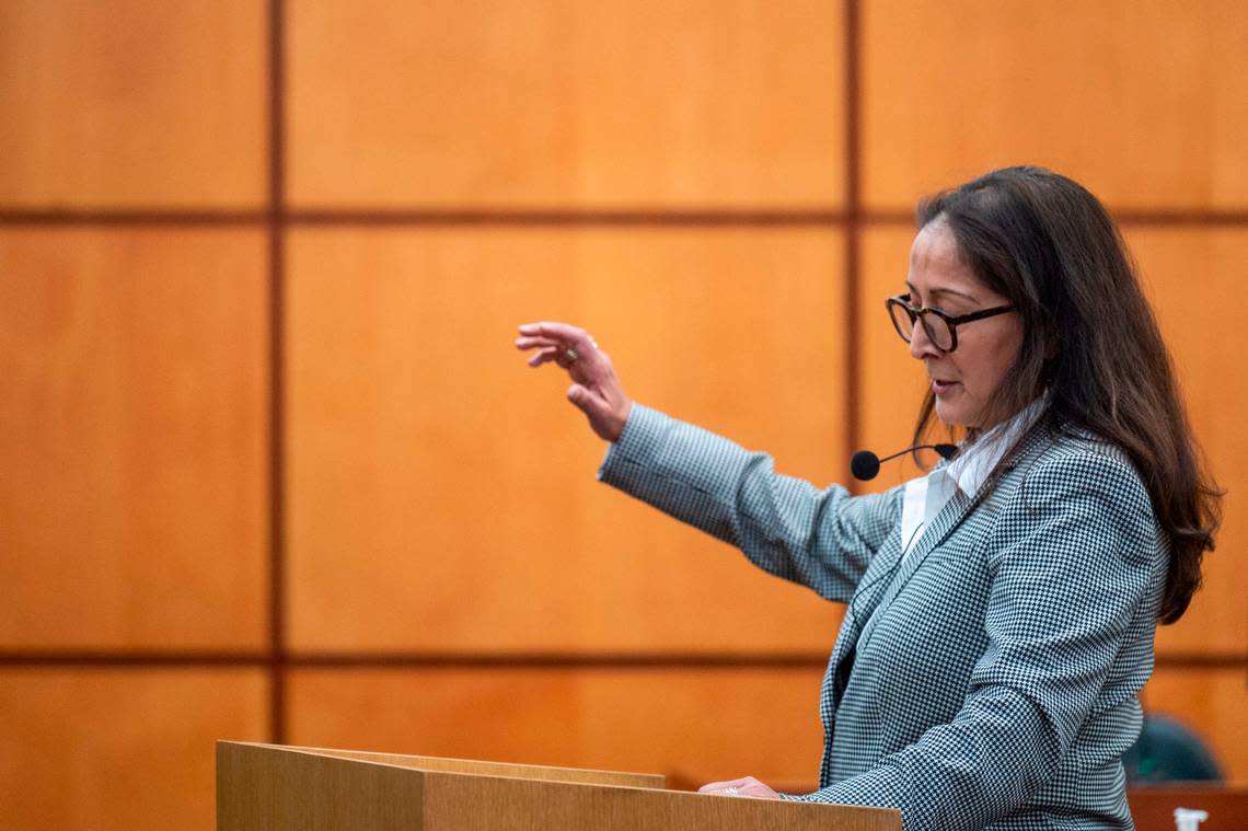 Washington state assistant attorney general Barbara Serrano addresses the jury with the prosecution’s opening statement in Pierce County District Court on Wednesday, Nov. 30, 2022, in Tacoma.