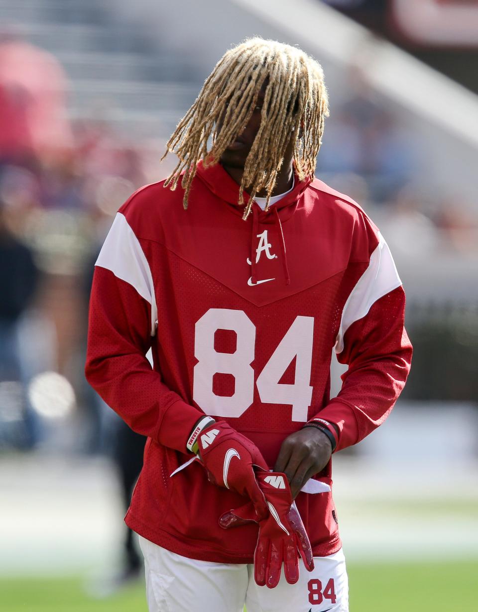 Nov 20, 2021; Tuscaloosa, Alabama, USA;  Alabama wide receiver Agiye Hall (84) has his hair down as he comes onto the field to warm up before the game with Arkansas at Bryant-Denny Stadium. Mandatory Credit: Gary Cosby Jr.-USA TODAY Sports