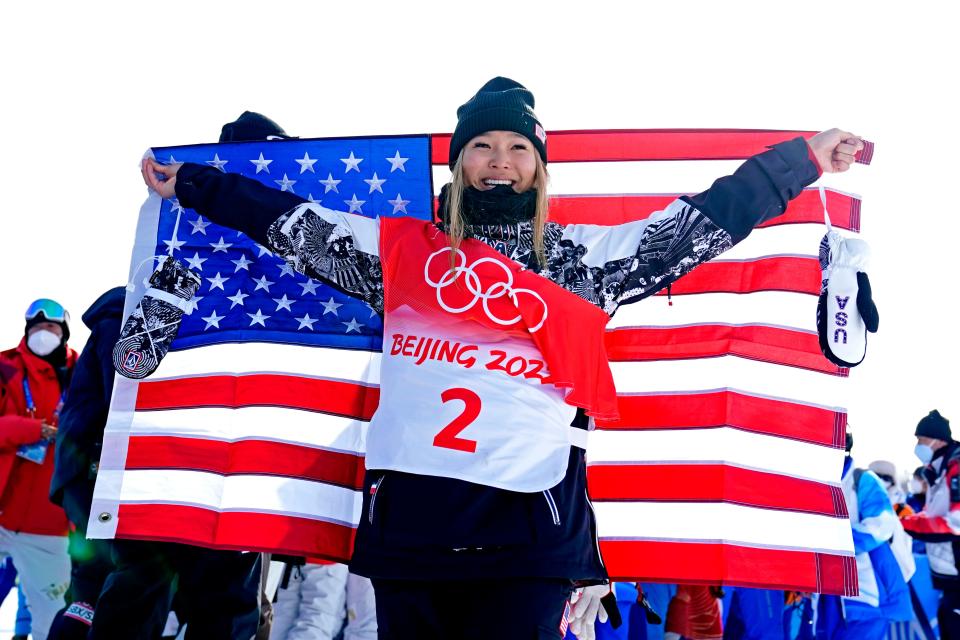 Chloe Kim celebrates he second consecutive snowboard halfpipe gold medal.