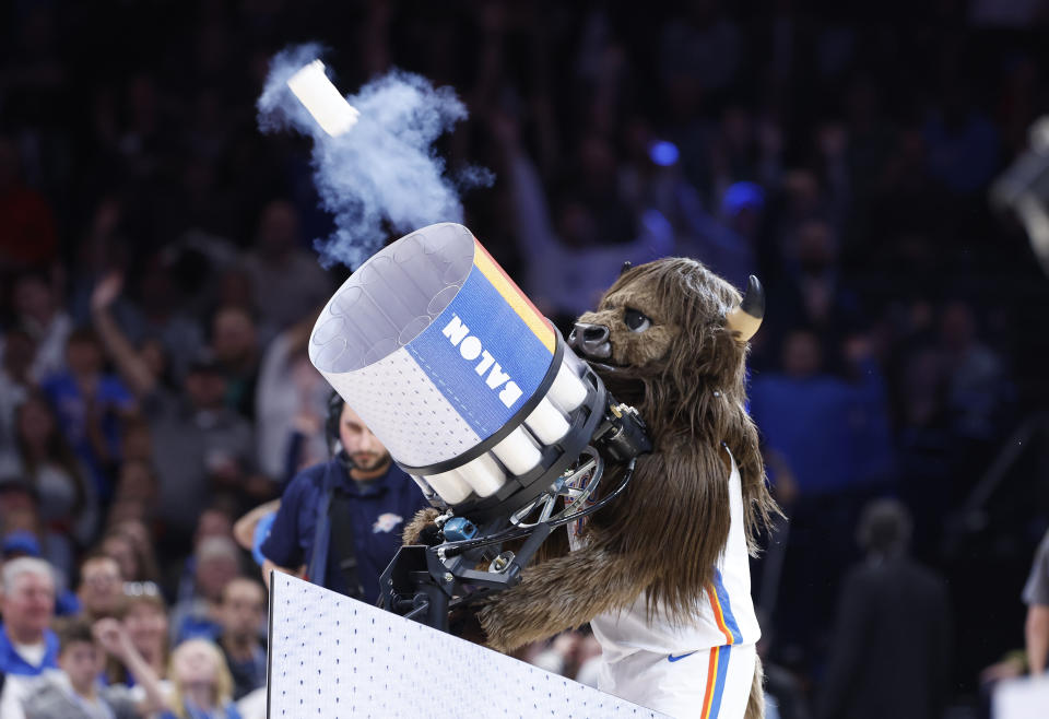 Nov 22, 2023; Oklahoma City, Oklahoma, USA; Oklahoma City Thunder mascot Rumble the Bison shoots t-shirts out of a canon during a time out against the Chicago Bulls during the second half at Paycom Center. Mandatory Credit: Alonzo Adams-USA TODAY Sports