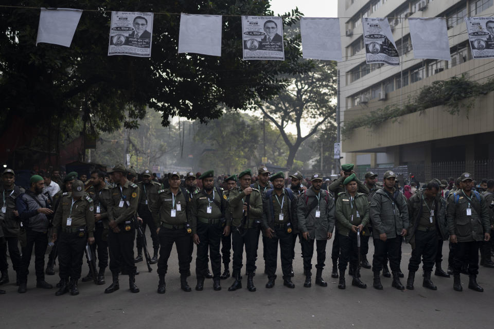 Security officers wait to be deputed to various polling stations in Dhaka, Bangladesh, Saturday, Jan. 6, 2024. Bangladesh's main opposition party has enforced a 48-hour general strike from Saturday across the South Asian nation as the nation is ready to hold its next general election a day later. (AP Photo/Altaf Qadri)