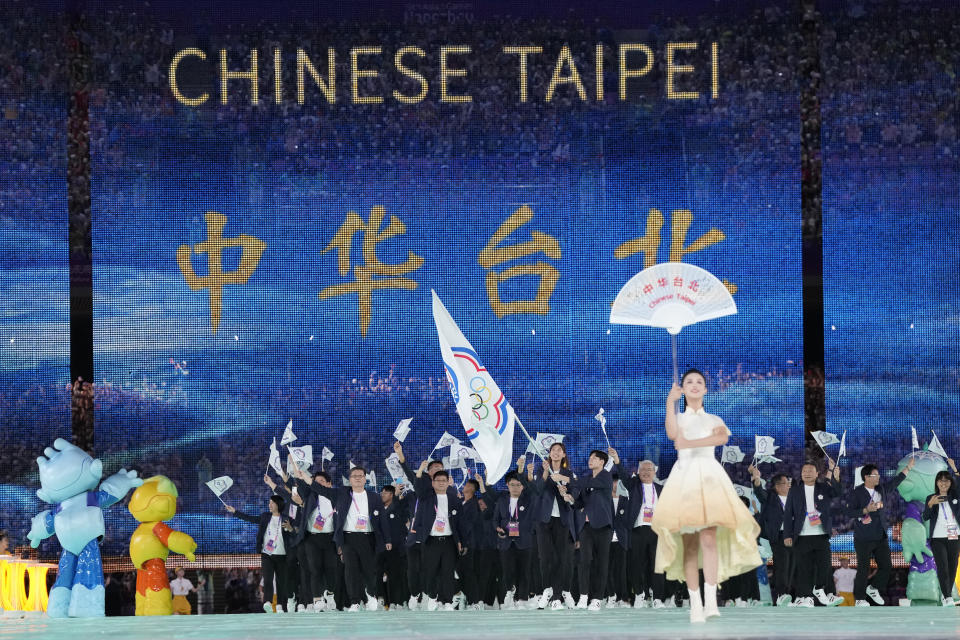 Taiwan's athletes and team officials arrive during the opening ceremony of the 19th Asian Games in Hangzhou, China, Saturday, Sept. 23, 2023. At the Asian Games China has been going out of its way to be welcoming to the Taiwanese athletes, as it pursues a two-pronged strategy with the goal of taking over the island, which involves both wooing its people while threatening it militarily. (AP Photo/Lee Jin-man, File)