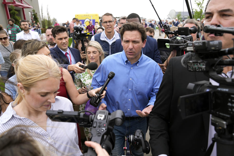 Florida Gov. Ron DeSantis talks with reporters after speaking at a fundraising picnic for U.S. Rep. Randy Feenstra, R-Iowa, Saturday, May 13, 2023, in Sioux Center, Iowa. (AP Photo/Charlie Neibergall)