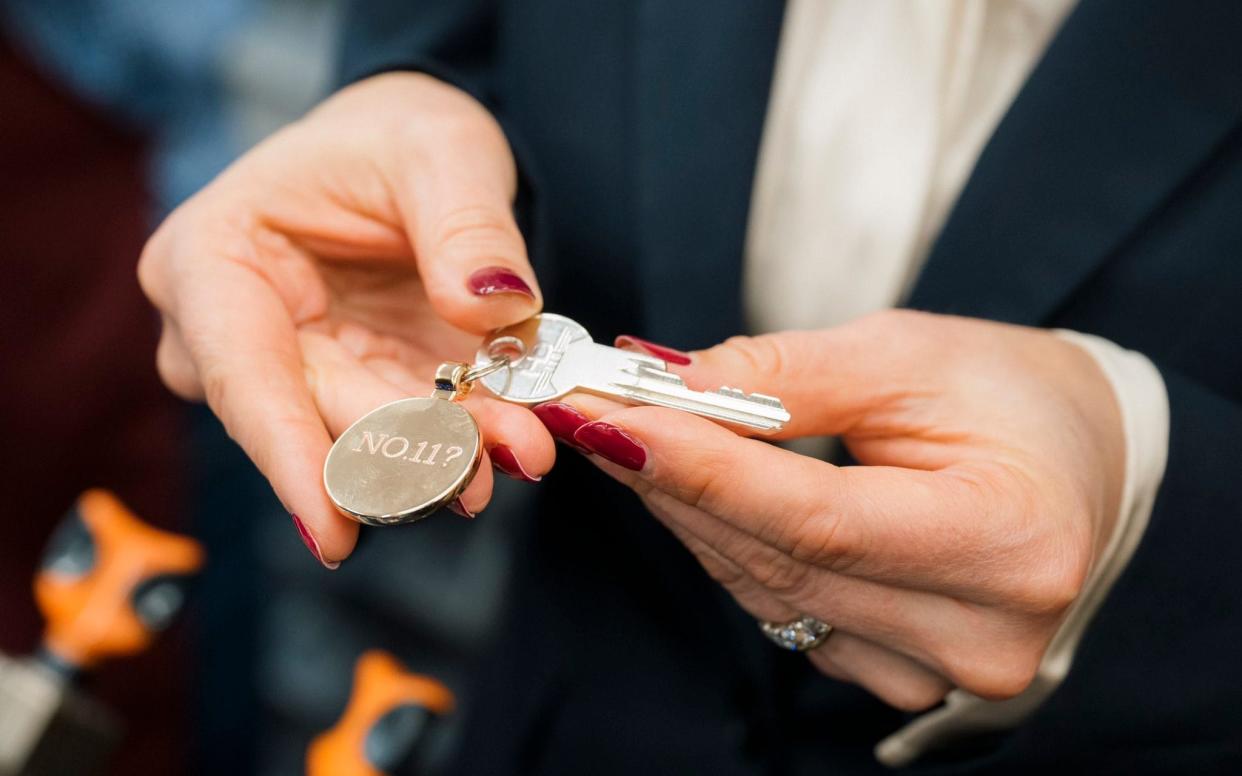 Rachel Reeves holds 'No11?' key at Timpson store in Staffordshire